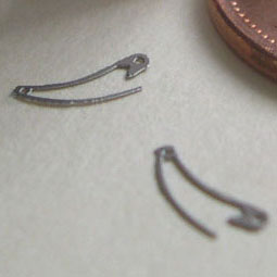 2 nappy pins