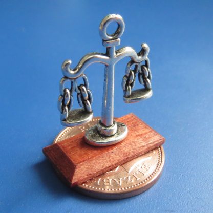 Scales on Wooden Base